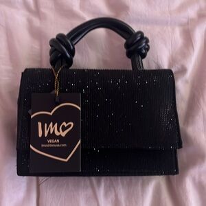 Cute formal jewel black handbag.